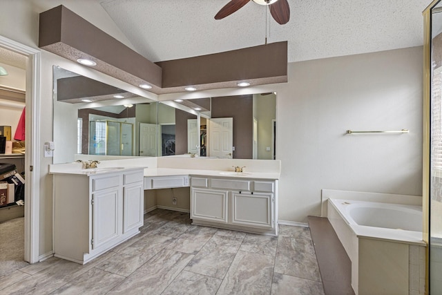1317 Woodthorpe Dr, Mesquite, TX 75181 - full bath with vaulted ceiling, ceiling fan, double vanity, a garden tub, and baseboards