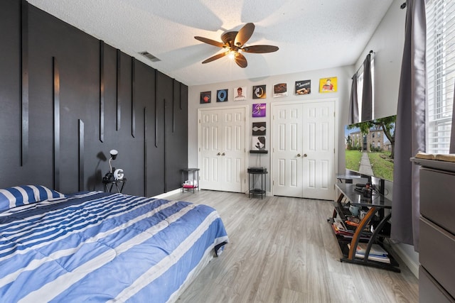 1317 Woodthorpe Dr, Mesquite, TX 75181 - bedroom with wood finished floors, a textured ceiling, ceiling fan, and baseboards