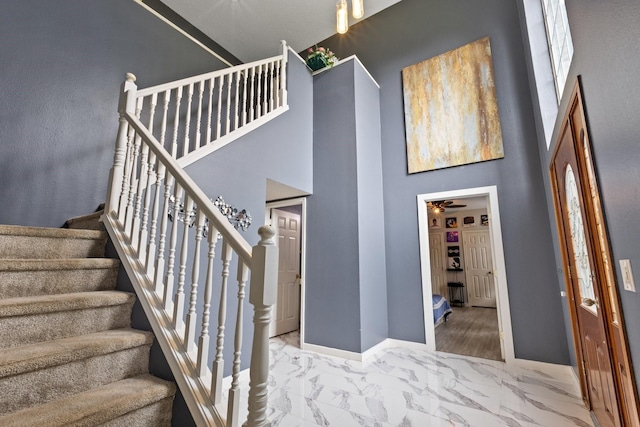 1317 Woodthorpe Dr, Mesquite, TX 75181 - stairway featuring marble finish flooring, a high ceiling, baseboards, and a ceiling fan