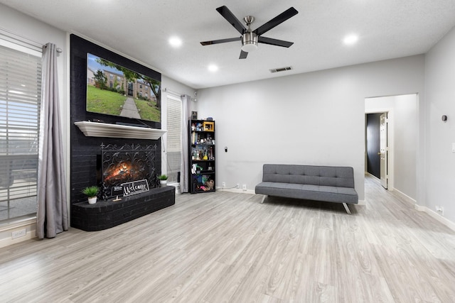 1317 Woodthorpe Dr, Mesquite, TX 75181 - living area with a fireplace, wood finished floors, a ceiling fan, baseboards, and recessed lighting