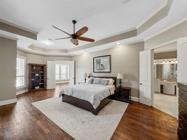 2901 Lakeview Dr, Prosper, TX 75078 - bedroom featuring a raised ceiling, ornamental molding, dark wood finished floors, a ceiling fan, and connected bathroom