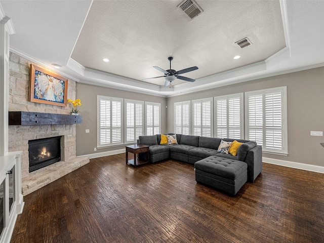 2901 Lakeview Dr, Prosper, TX 75078 - living area featuring a tray ceiling, a fireplace, ceiling fan, wood finished floors, and crown molding