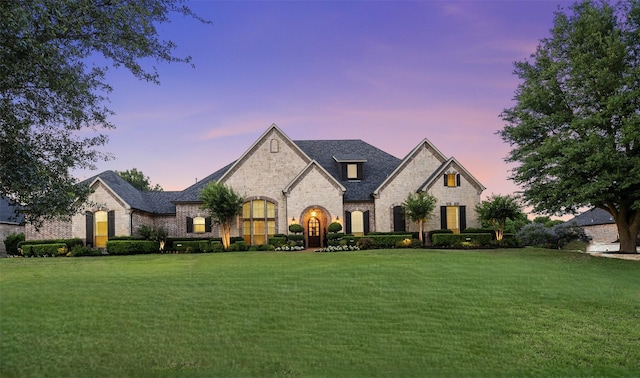 2901 Lakeview Dr, Prosper, TX 75078 - french country style house with stone siding, a lawn, and brick siding