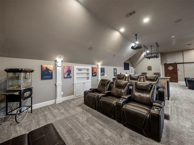 2901 Lakeview Dr, Prosper, TX 75078 - carpeted cinema room with a barn door, vaulted ceiling, and built in features