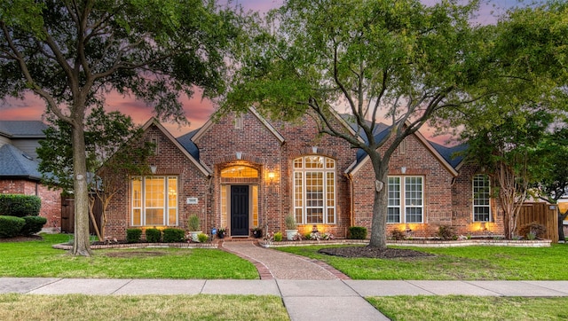 7699 Thistletree Ln, Frisco, TX 75033 - traditional-style house featuring brick siding, a front yard, and a chimney
