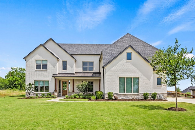 3416 Dovehill Dr, Northlake, TX 76247 - view of front facade featuring a front lawn, a standing seam roof, a shingled roof, and brick siding