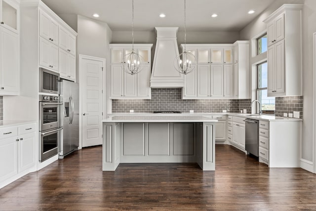 3416 Dovehill Dr, Northlake, TX 76247 - kitchen featuring stainless steel appliances, custom range hood, a chandelier, a center island, and light countertops