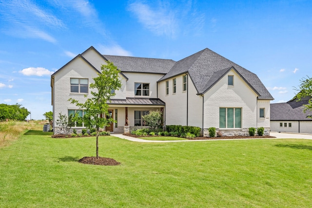 3416 Dovehill Dr, Northlake, TX 76247 - view of front of home with a standing seam roof, a porch, a front lawn, metal roof, and a shingled roof