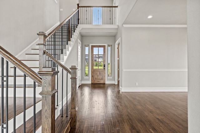 3416 Dovehill Dr, Northlake, TX 76247 - foyer featuring wood finished floors, a towering ceiling, stairway, baseboards, and crown molding