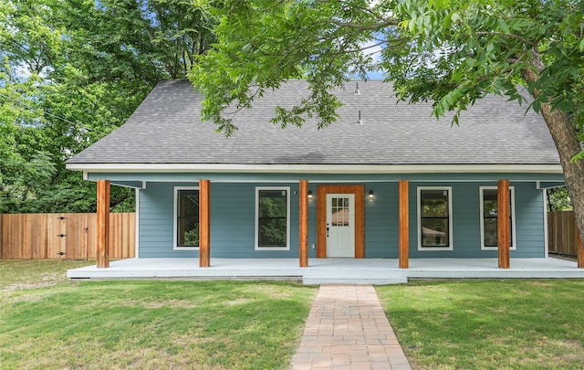 104 W 2nd St, Waxahachie, TX 75165 - view of front facade with a shingled roof and covered porch