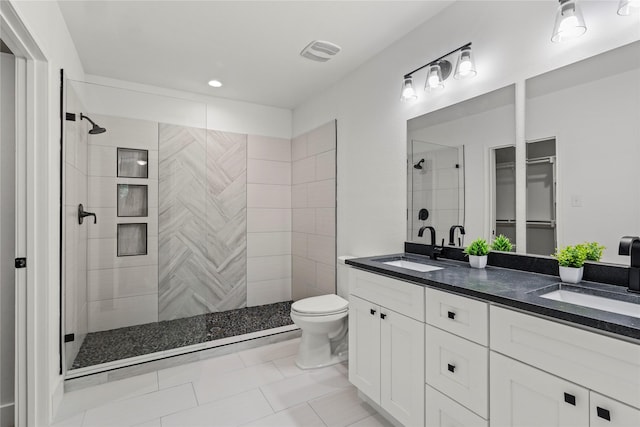104 W 2nd St, Waxahachie, TX 75165 - full bath with tiled shower, double vanity, toilet, and tile patterned floors