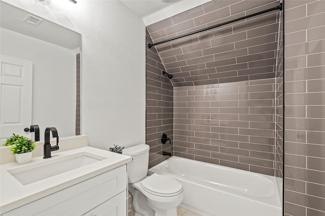 104 W 2nd St, Waxahachie, TX 75165 - full bath with vanity, toilet, shower / bath combination, and a textured wall