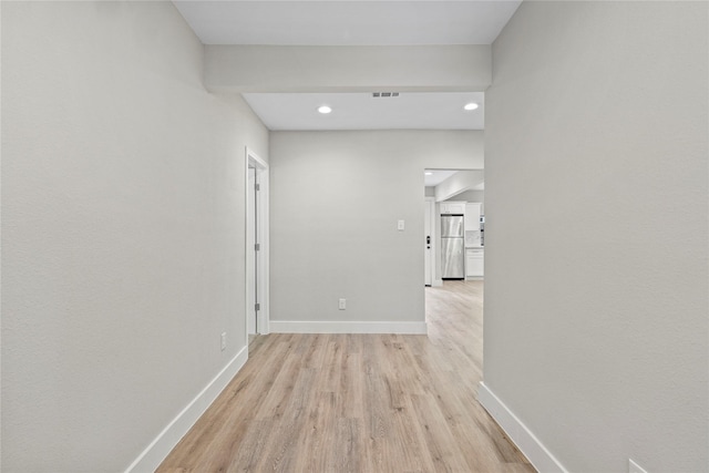 104 W 2nd St, Waxahachie, TX 75165 - hall featuring light wood-type flooring, baseboards, and recessed lighting