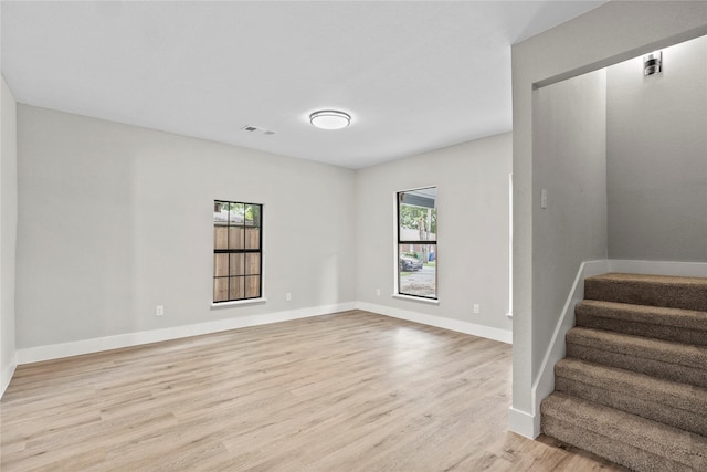104 W 2nd St, Waxahachie, TX 75165 - spare room featuring light wood finished floors, stairs, and baseboards