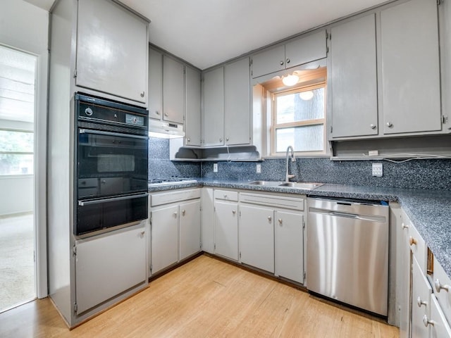 5512 Dennis Ave, Fort Worth, TX 76114 - kitchen featuring stainless steel dishwasher, black oven, a warming drawer, a sink, and dark countertops
