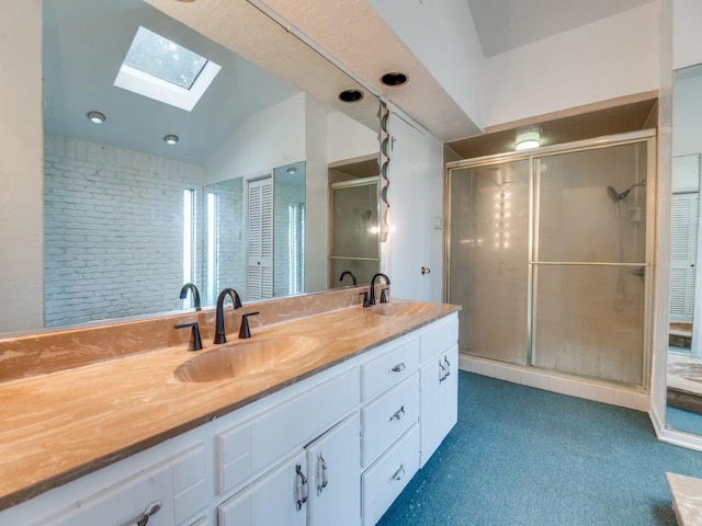 5512 Dennis Ave, Fort Worth, TX 76114 - bathroom with a skylight, double vanity, lofted ceiling, and a shower stall