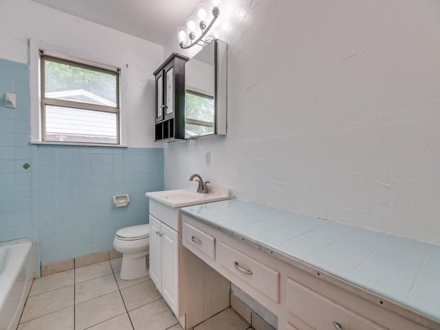 5512 Dennis Ave, Fort Worth, TX 76114 - full bath with tile walls, toilet, vanity, tile patterned flooring, and a wainscoted wall