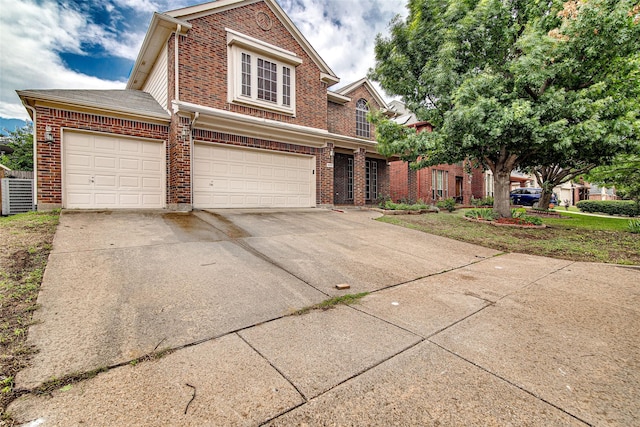 4621 Maple Hill Dr, Fort Worth, TX 76123 - traditional-style home with brick siding, driveway, central AC, and a garage
