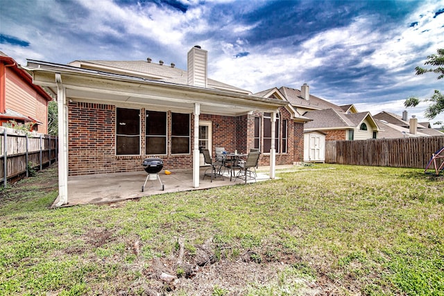 4621 Maple Hill Dr, Fort Worth, TX 76123 - rear view of house featuring brick siding, a chimney, and a patio