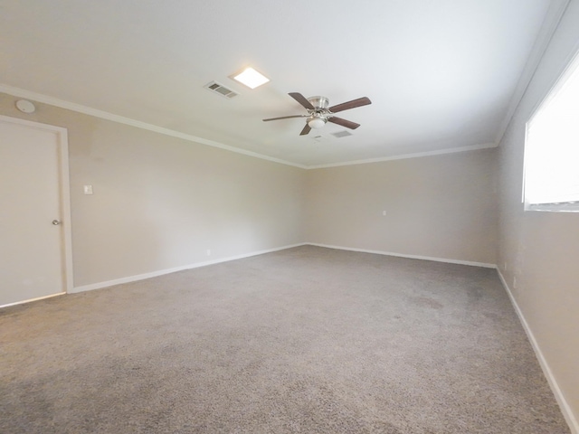 1418 Royal Dr, Kaufman, TX 75142 - carpeted spare room featuring ceiling fan, baseboards, and crown molding