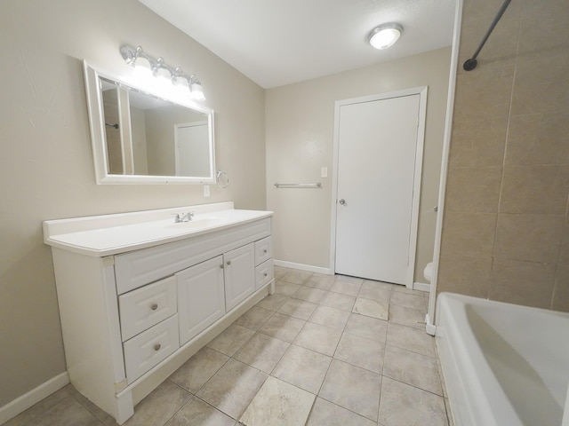 1418 Royal Dr, Kaufman, TX 75142 - bathroom featuring vanity, tile patterned floors, baseboards, and shower / bathtub combination