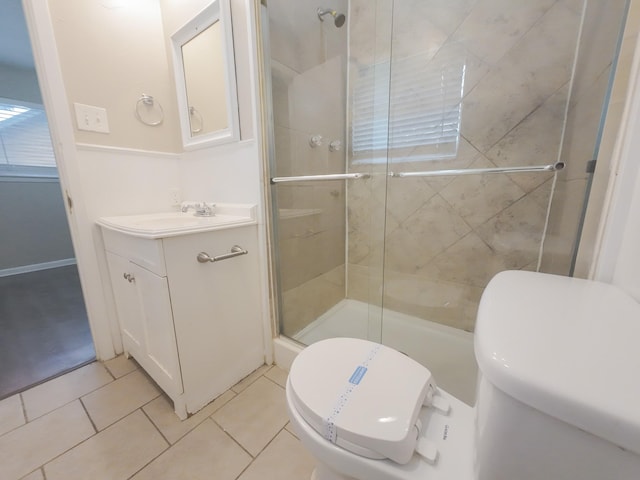 1418 Royal Dr, Kaufman, TX 75142 - full bathroom featuring toilet, vanity, tile patterned flooring, and a shower stall