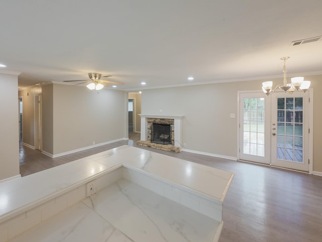1418 Royal Dr, Kaufman, TX 75142 - unfurnished living room featuring a fireplace, crown molding, a ceiling fan, a chandelier, and recessed lighting