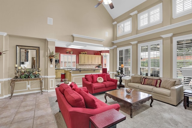 6628 Gray Wolf Dr, Plano, TX 75024 - living area with high vaulted ceiling, a ceiling fan, plenty of natural light, and light tile patterned flooring