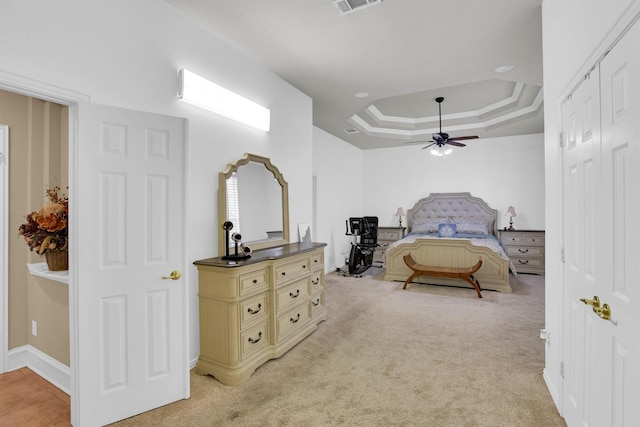 6628 Gray Wolf Dr, Plano, TX 75024 - bedroom with a raised ceiling, light carpet, a closet, and a ceiling fan