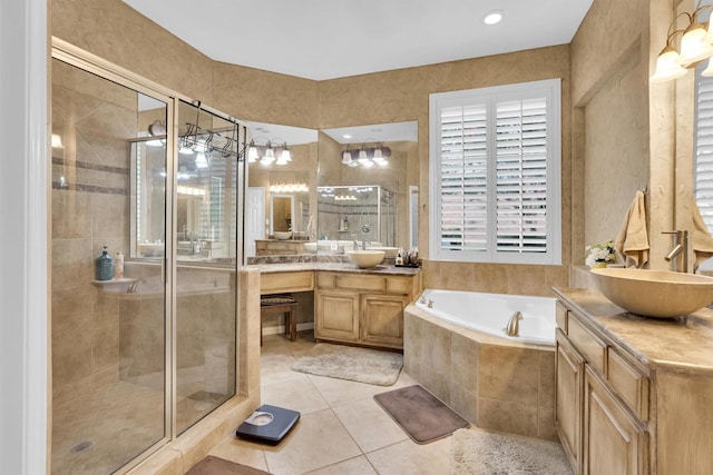 6628 Gray Wolf Dr, Plano, TX 75024 - full bath featuring two vanities, tile patterned flooring, a shower stall, and a garden tub