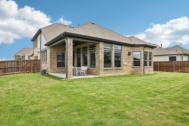 3200 Julian St, Mansfield, TX 76063 - back of property featuring a patio, brick siding, and a shingled roof