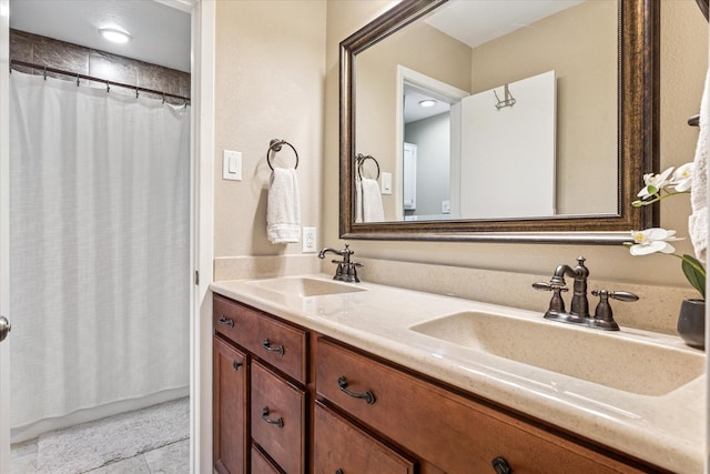 4116 Cole Ave Unit 302, Dallas, TX 75204 - full bathroom with double vanity, curtained shower, and tile patterned floors