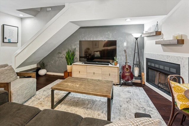 4116 Cole Ave Unit 302, Dallas, TX 75204 - living area featuring wood finished floors, a tiled fireplace, baseboards, and recessed lighting