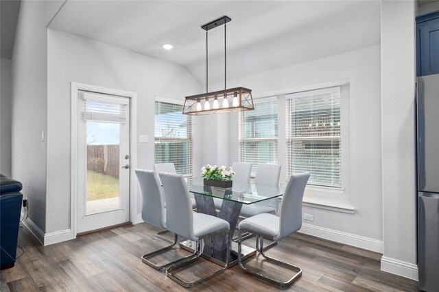 16304 Garden Dr, Celina, TX 75009 - dining room featuring baseboards, dark wood-type flooring, a chandelier, lofted ceiling, and recessed lighting