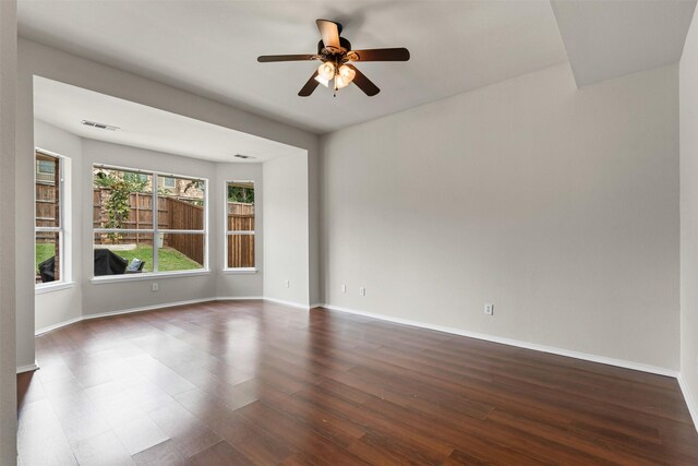 204 Forestview Rd, Hickory Creek, TX 75065 - unfurnished room featuring dark wood-style flooring, a ceiling fan, and baseboards