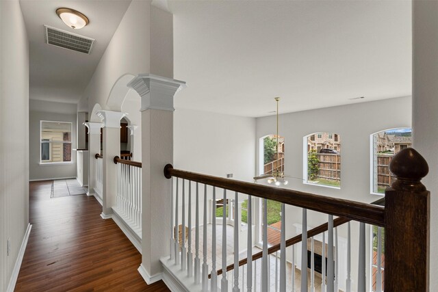 204 Forestview Rd, Hickory Creek, TX 75065 - hall with wood finished floors, an upstairs landing, baseboards, and decorative columns