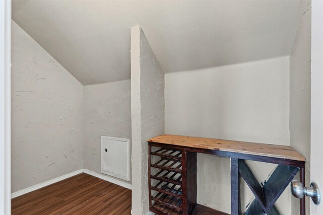 204 Forestview Rd, Hickory Creek, TX 75065 - wine area featuring vaulted ceiling, wood finished floors, and baseboards