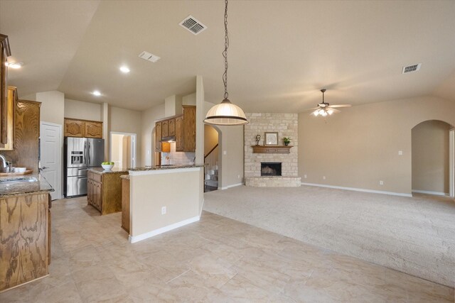 304 Adobe Lilly Ct, Mansfield, TX 76063 - kitchen featuring stainless steel refrigerator with ice dispenser, a ceiling fan, lofted ceiling, a sink, and a center island