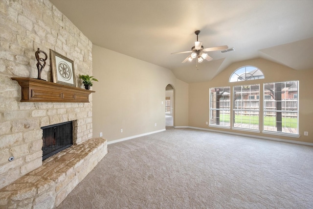 304 Adobe Lilly Ct, Mansfield, TX 76063 - unfurnished living room featuring carpet, a fireplace, a ceiling fan, arched walkways, and lofted ceiling
