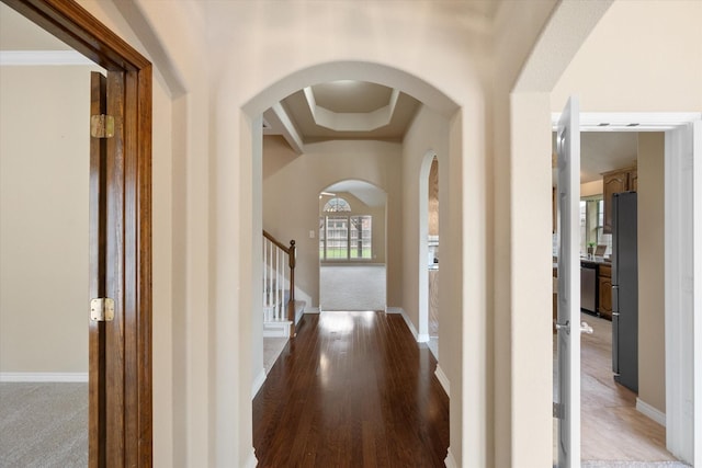 304 Adobe Lilly Ct, Mansfield, TX 76063 - entrance foyer featuring arched walkways, baseboards, stairway, and light wood-style floors