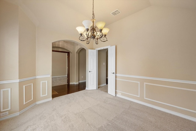 304 Adobe Lilly Ct, Mansfield, TX 76063 - carpeted spare room with arched walkways, a chandelier, and lofted ceiling