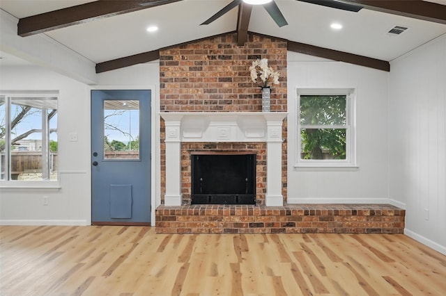 9813 Bancroft Dr, Benbrook, TX 76126 - unfurnished living room featuring a fireplace, wood finished floors, a ceiling fan, baseboards, and a decorative wall