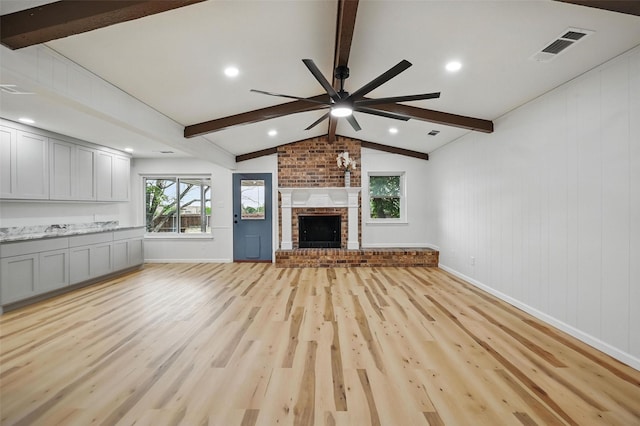 9813 Bancroft Dr, Benbrook, TX 76126 - unfurnished living room featuring a ceiling fan, light wood-style floors, baseboards, and a fireplace