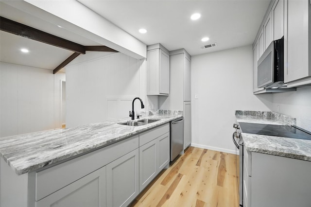9813 Bancroft Dr, Benbrook, TX 76126 - kitchen with appliances with stainless steel finishes, a sink, light wood finished floors, light stone countertops, and beamed ceiling