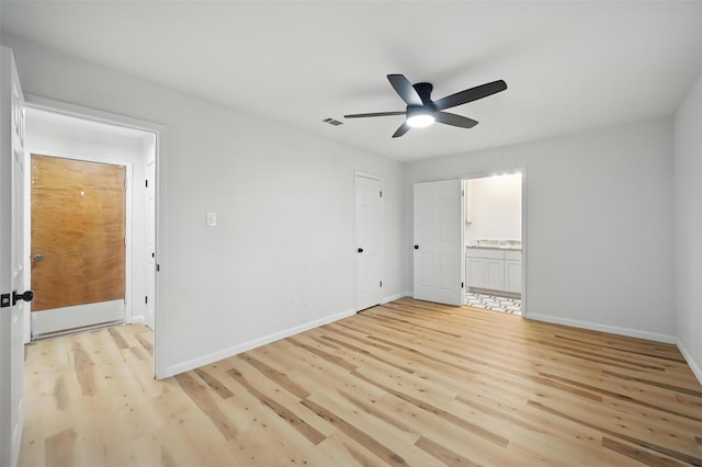 9813 Bancroft Dr, Benbrook, TX 76126 - unfurnished bedroom featuring light wood-style floors, baseboards, ensuite bathroom, and ceiling fan