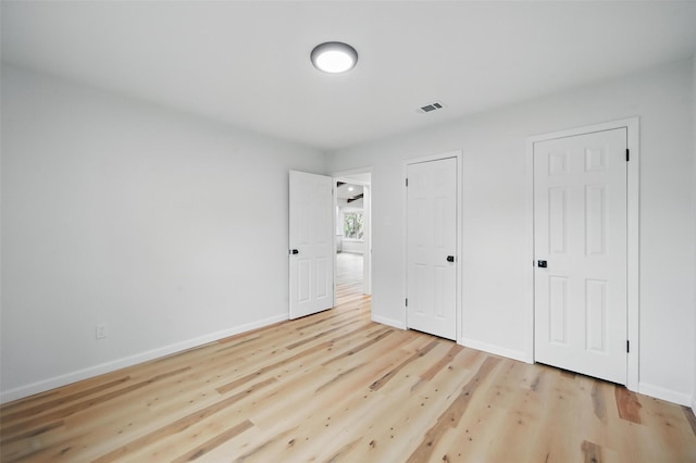 9813 Bancroft Dr, Benbrook, TX 76126 - unfurnished bedroom featuring light wood finished floors and baseboards