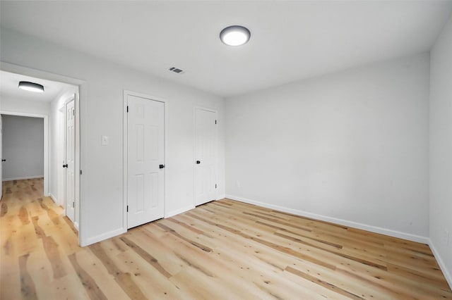 9813 Bancroft Dr, Benbrook, TX 76126 - unfurnished bedroom featuring light wood-type flooring and baseboards