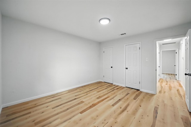 9813 Bancroft Dr, Benbrook, TX 76126 - unfurnished bedroom featuring light wood-type flooring and baseboards