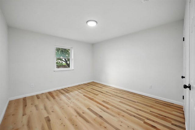 9813 Bancroft Dr, Benbrook, TX 76126 - unfurnished room with baseboards and wood finished floors
