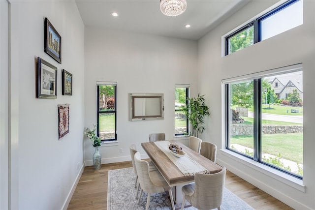 1209 Hicks Trl, Lucas, TX 75002 - dining area with a high ceiling, baseboards, light wood-type flooring, recessed lighting, and a chandelier